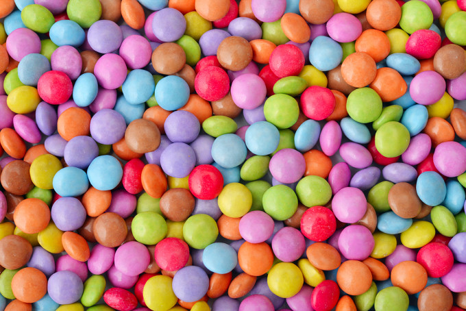 Sweet round multicolor candies spreading  on background